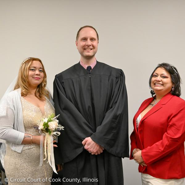 Pictured is Veronica Mora and Dunia Guadalupe Aguiriano Bautista, of East Chicago, and Judge Michael Zink after their marriage ceremony